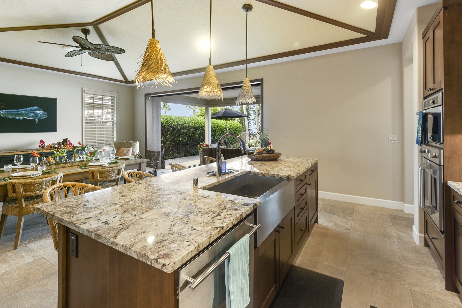 Prepare your favorite meals in this stunning gourmet kitchen with granite countertops, stainless steel appliances, and beautiful pendant lighting.