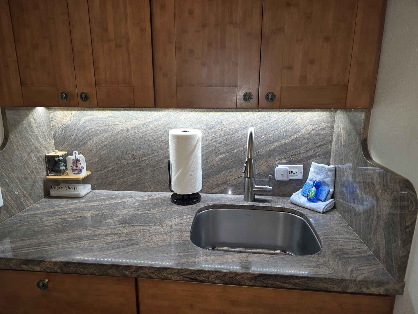 Your compact kitchenette features granite counters and modern fixtures, perfect for preparing light meals during your stay.