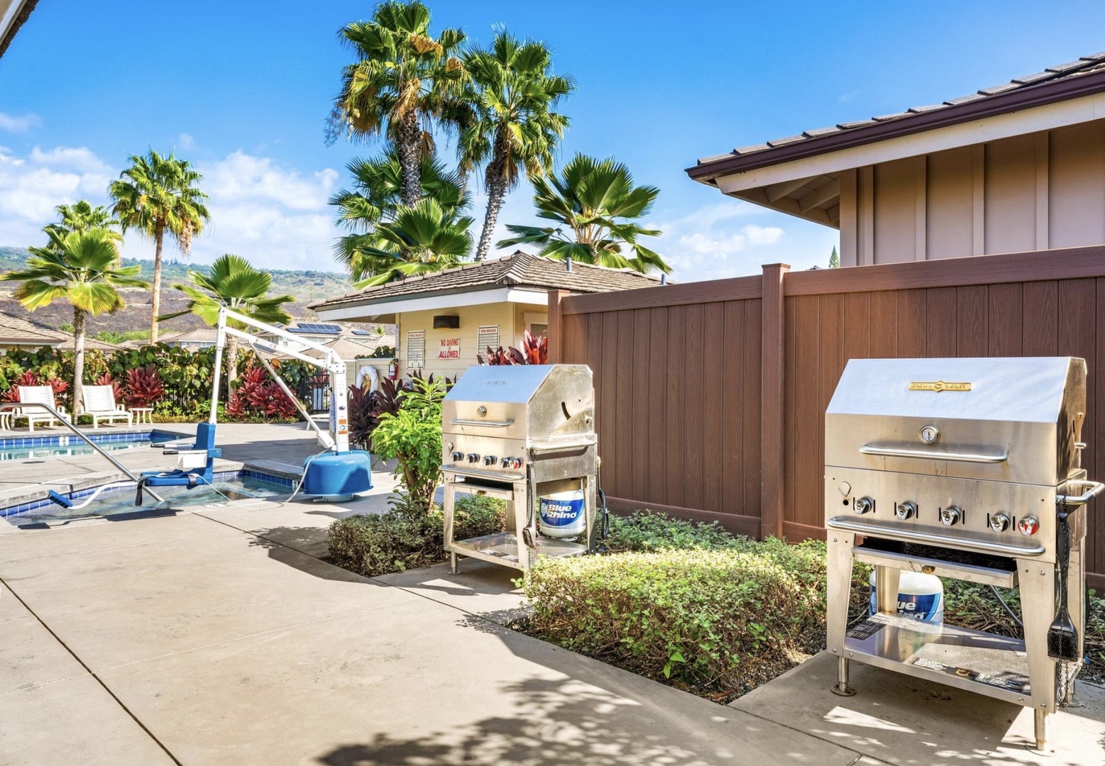 Fire up the community outdoor grills for memorable meals in this tropical paradise, surrounded by swaying palms and pool views.