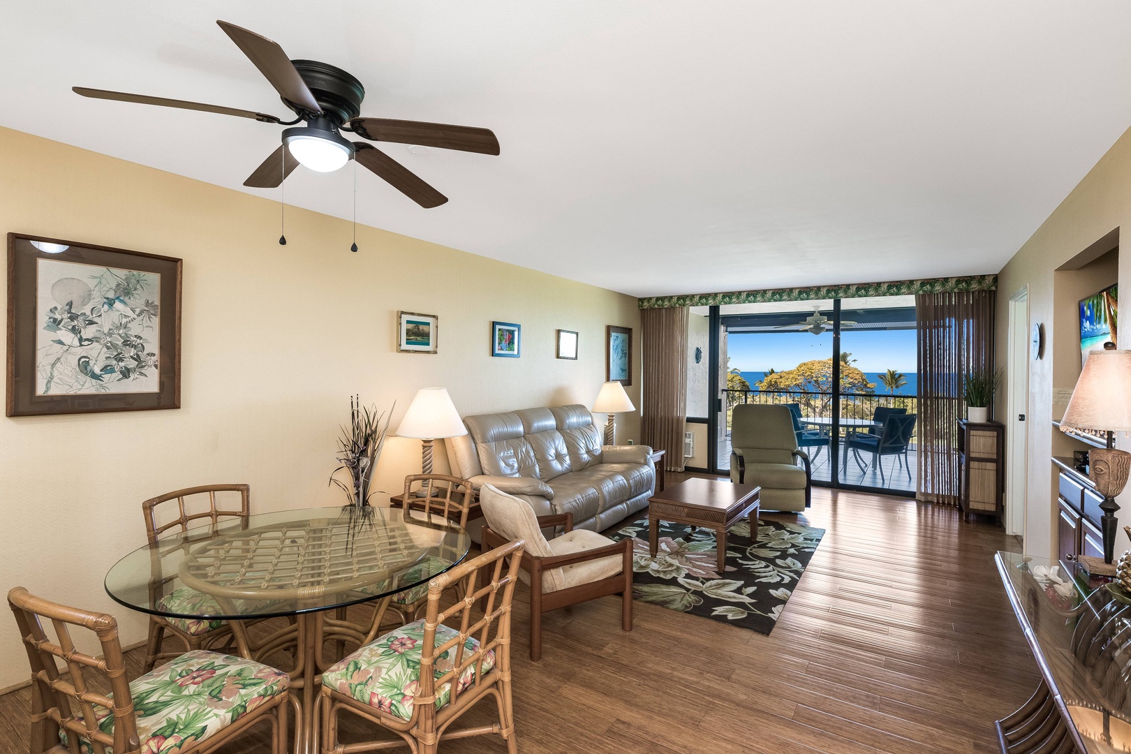Step into your island-inspired living space where ocean breezes flow through sliding doors to your private balcony. The open design connects dining and relaxation areas, framed by sparkling sea views that invite you to unwind in comfort.