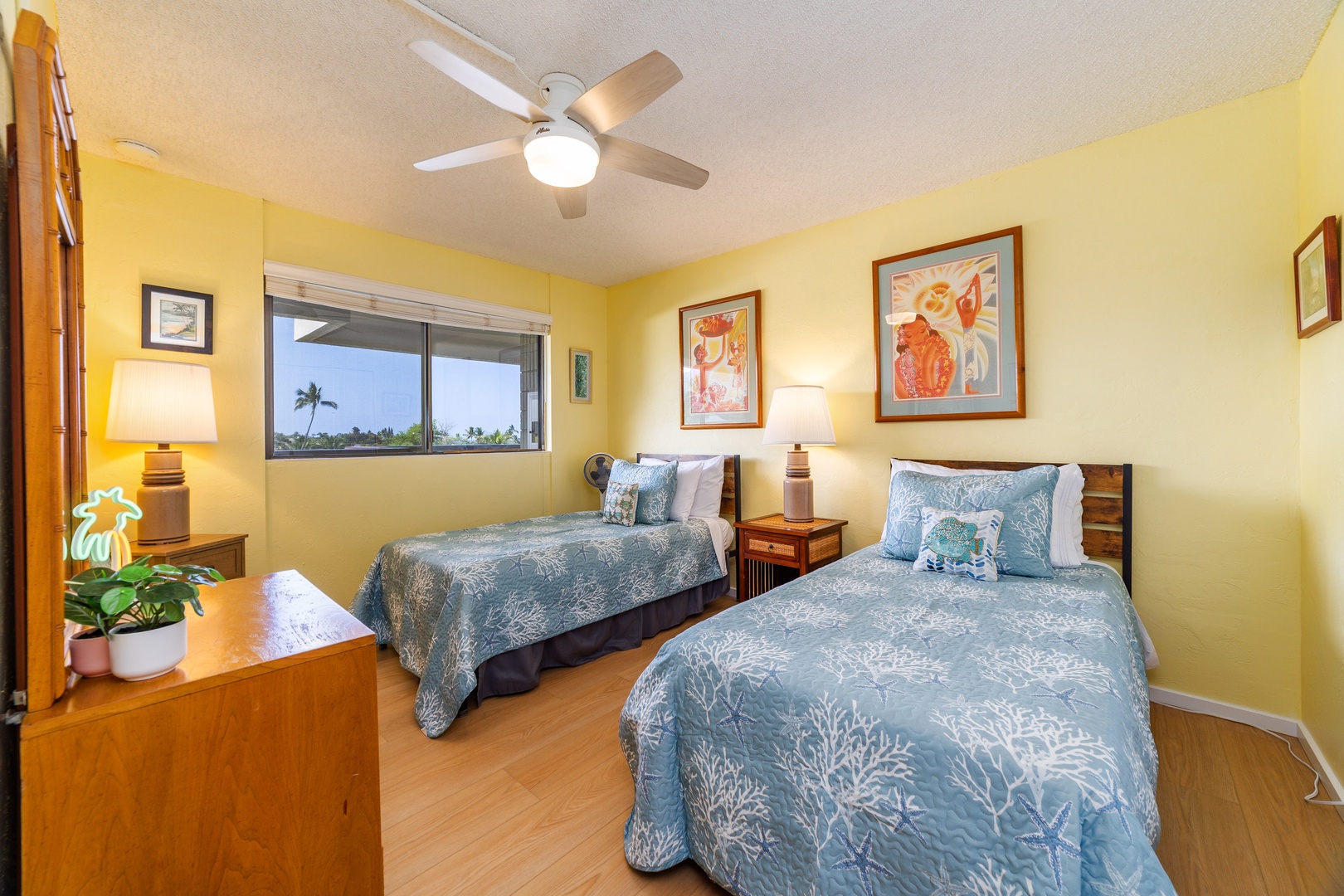 Wake up refreshed in your cheerful island-themed bedroom, complete with tropical breezes from the ceiling fan and peaceful palm tree views through your window.