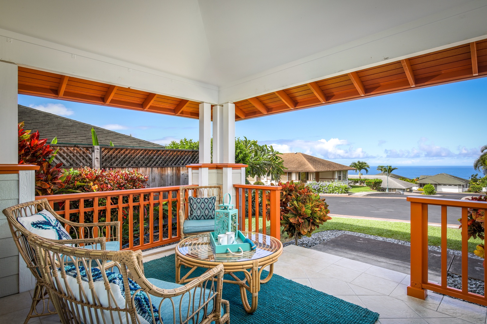 Relax on your private covered lanai with tropical gardens, ocean views, and cozy seating—perfect for morning coffee or evening unwinding in paradise.