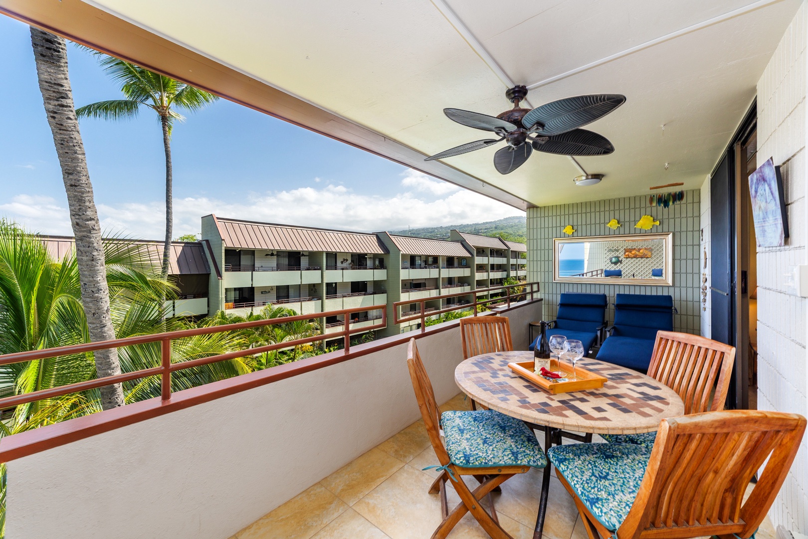 Relax on your private lanai with tropical breezes from the ceiling fan and peek-a-boo ocean views framed by swaying palms—perfect for morning coffee or sunset cocktails.