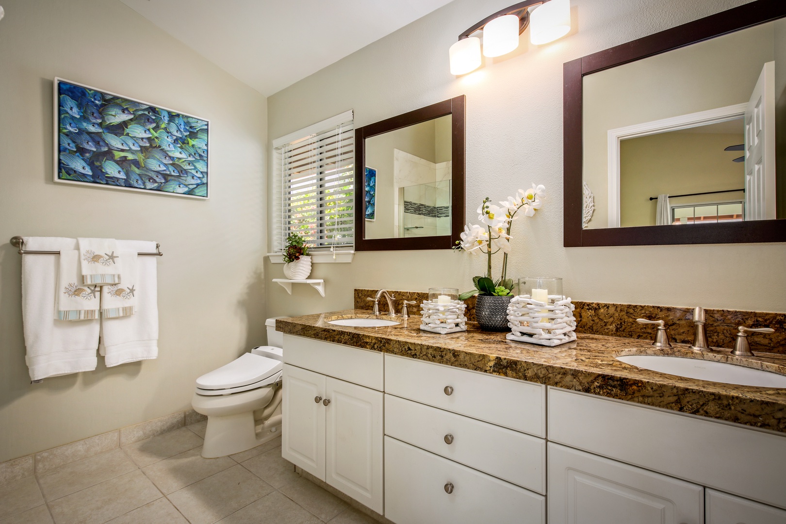 Unwind in your spa-inspired bathroom, where polished granite countertops, dual sinks, and warm lighting set the stage for a refreshing start to your day.