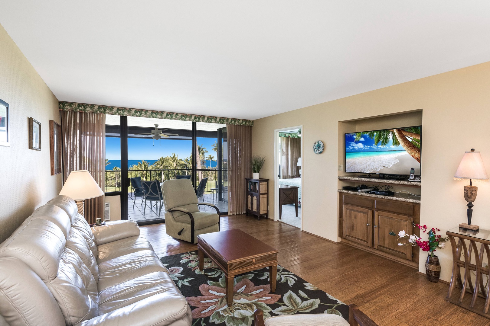 Sink into plush furnishings while gazing at stunning ocean vistas through floor-to-ceiling glass. Your private balcony awaits morning coffee moments, and a large TV makes evenings just as inviting.