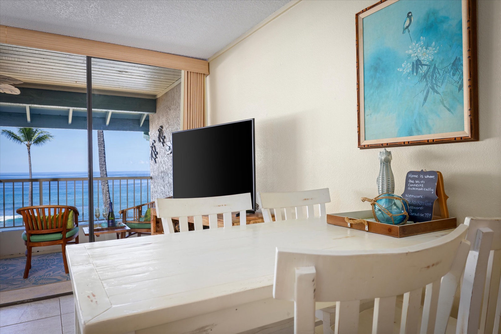 Gather around the bright dining table with your crew, ocean views stretching out beyond the lanai. Mornings feel effortless here with coffee, conversation, and the calming palette of sea and sky.