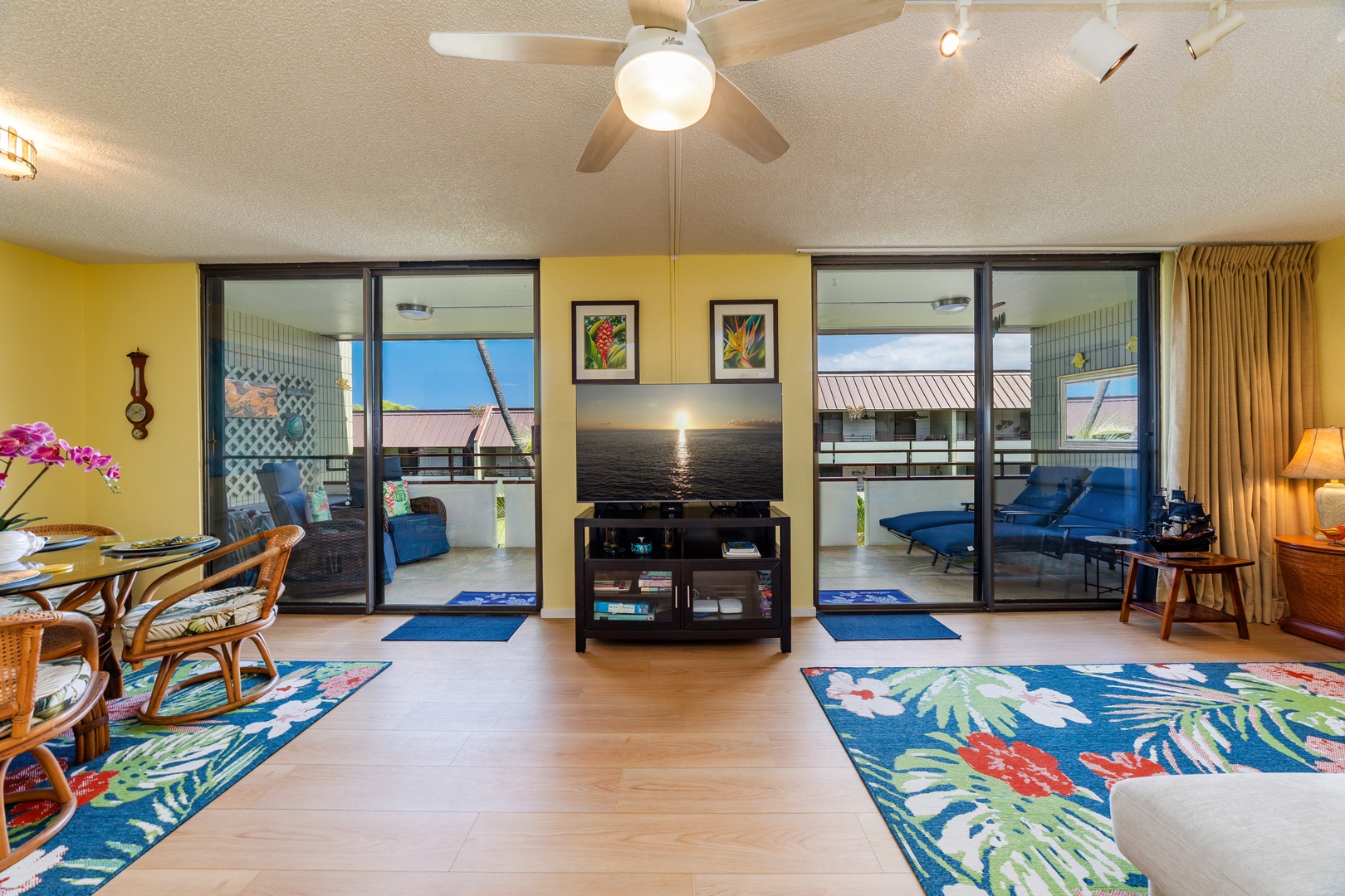 Unwind in your cheerful living space, where vibrant tropical colors meet comfort and island breezes flow through sliding glass doors to your private balcony.