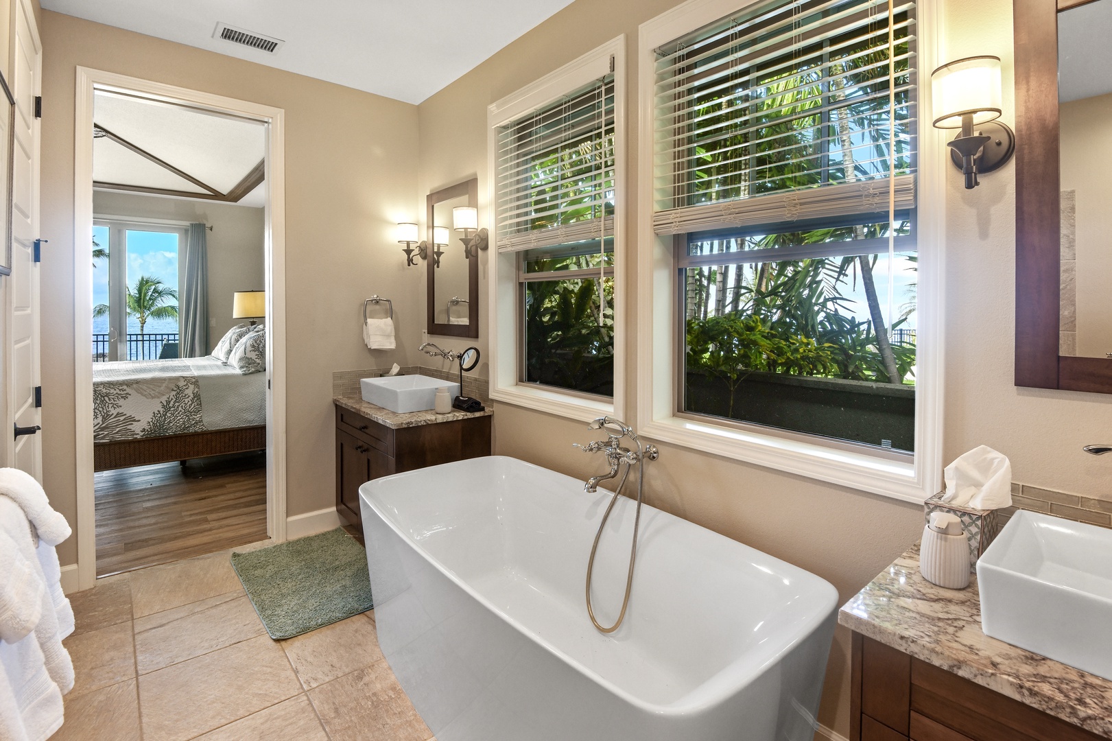 Soak in your private soaking tub with tropical garden views streaming through the window.