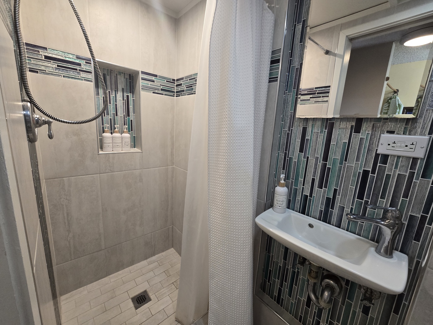 Step into your beautifully appointed bathroom with elegant tiled shower, modern fixtures, and thoughtful amenities to refresh after your adventures.