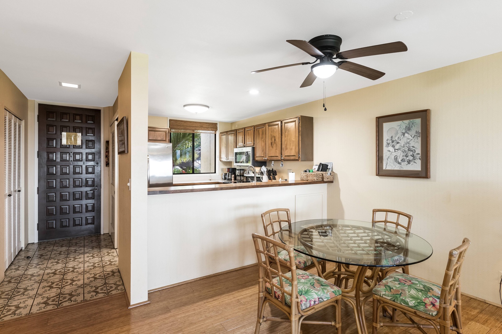Gather around the glass dining table for meals with your group, while the open kitchen lets conversation flow effortlessly. The ceiling fan keeps things cool and comfortable.