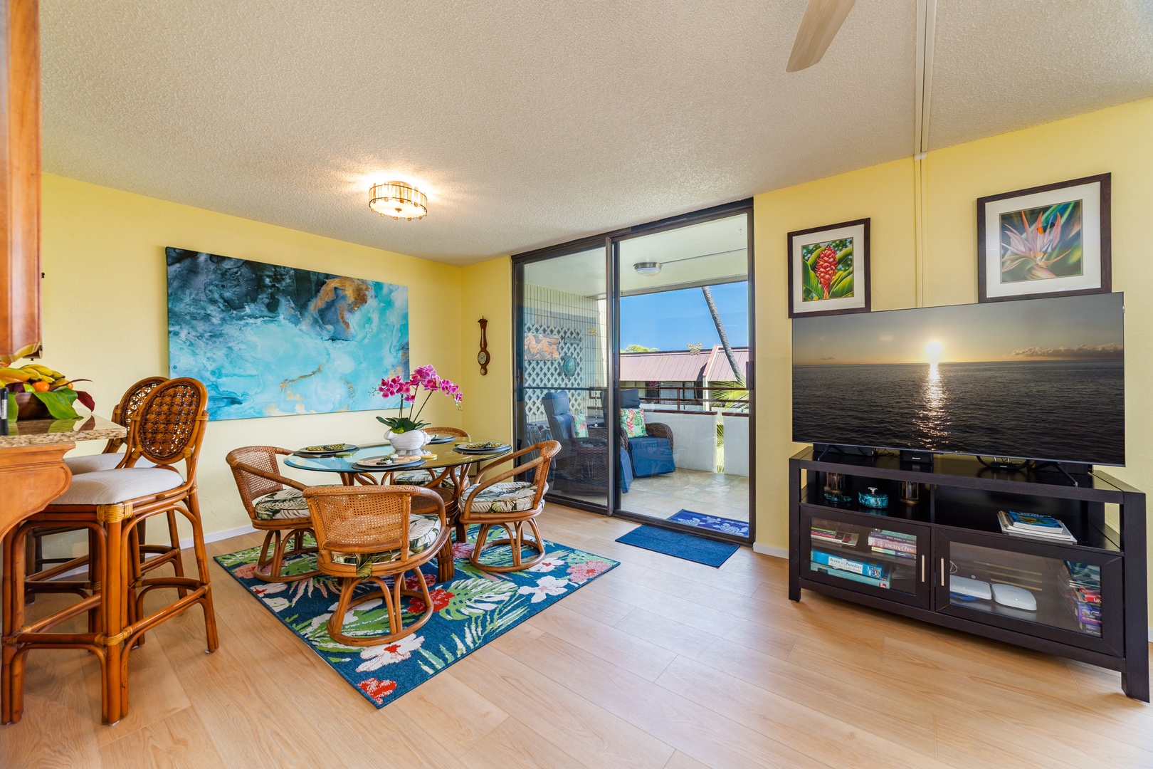 Gather around this inviting dining nook where tropical charm meets comfort. Enjoy your morning coffee or evening meal with cheerful decor, natural light streaming in, and easy access to your private lanai.