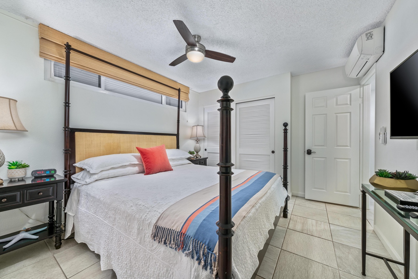 Step into your peaceful retreat with a stylish four-poster bed, cool ceiling fan, and climate-controlled comfort. This serene space offers restful nights and refreshing mornings during your stay.