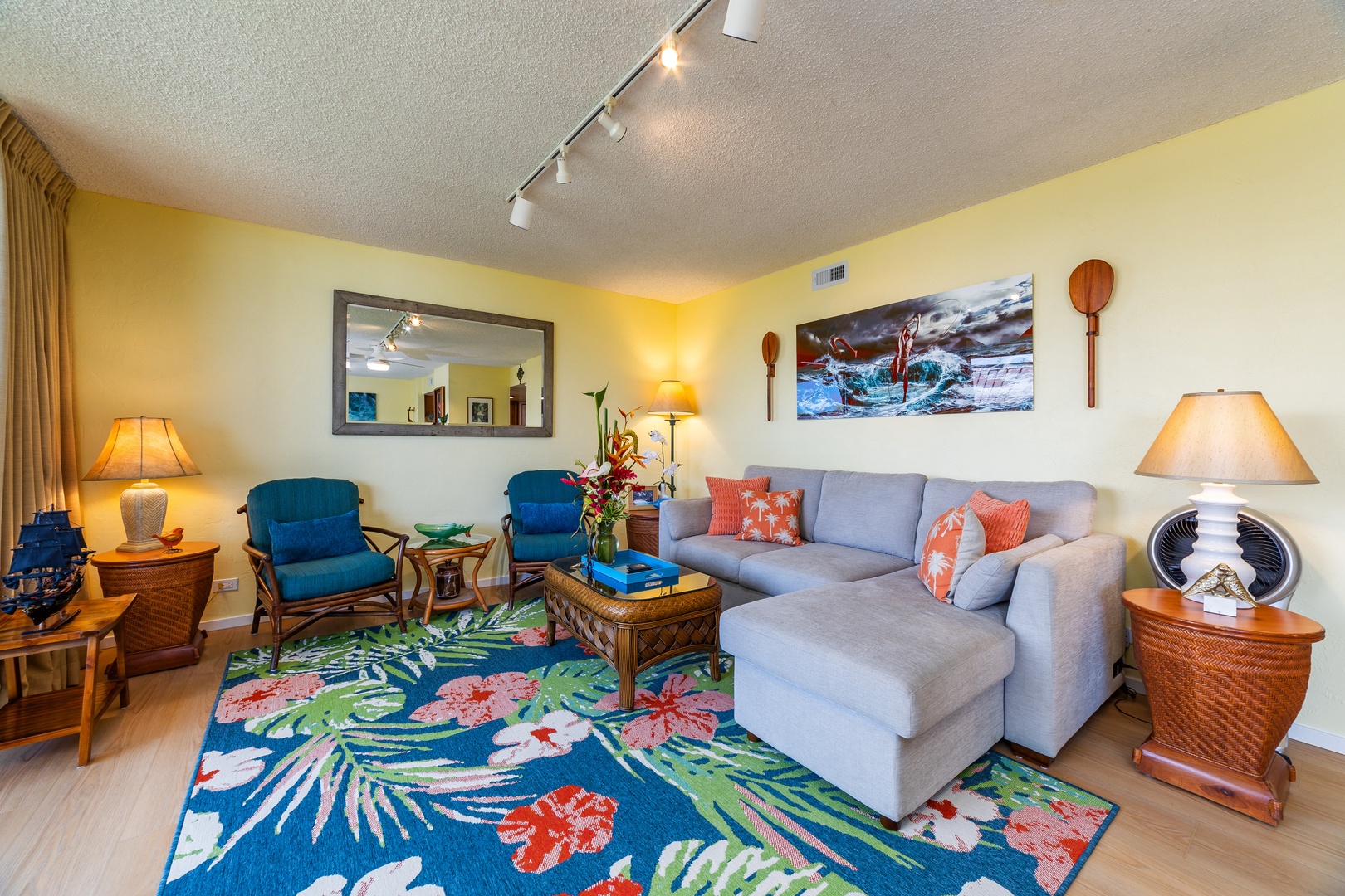 Relax into your Hawaiian getaway in this bright living space, where cheerful tropical decor and cozy seating invite you to unwind with island-inspired charm and comfort.