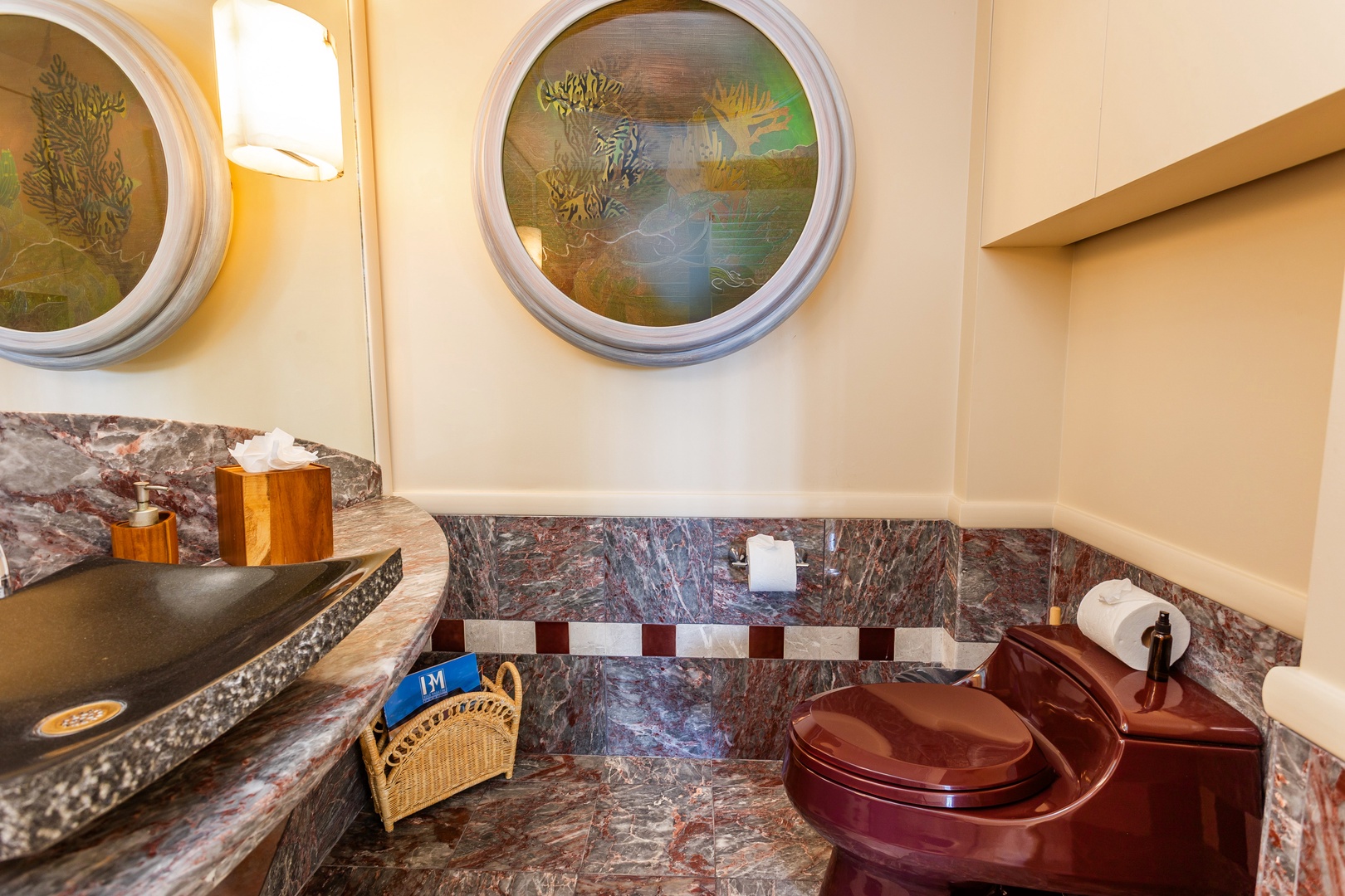 Powder Room - Rich marble surfaces and artistic circular accents create an elegant, thoughtfully designed space where every detail invites you to unwind and enjoy your private retreat.