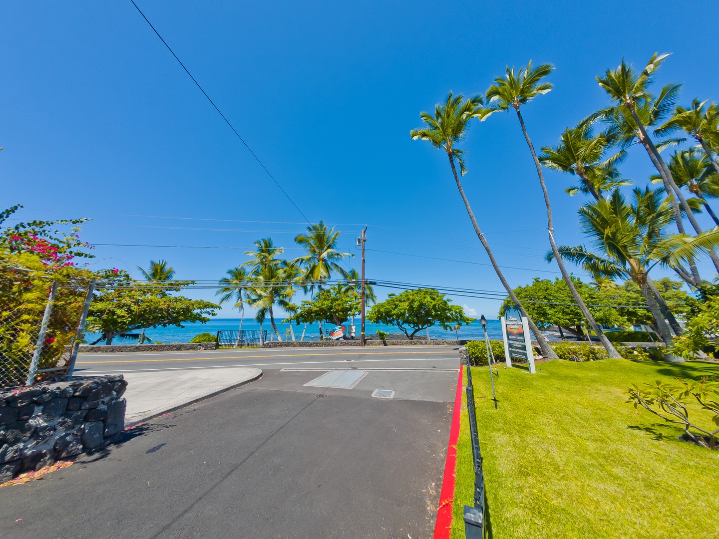 Kona Islander Inn is located in a vibrant beachfront neighborhood with swaying palms, turquoise ocean views, and easy access to scenic coastal roads and tropical landscapes.