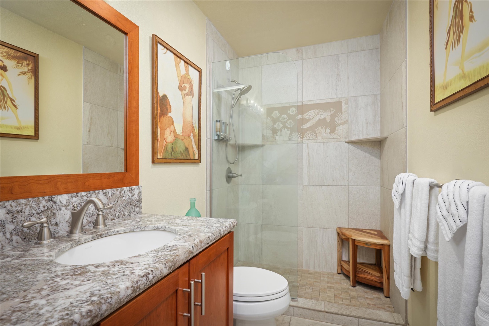 Refresh in your private bathroom with a spacious walk-in shower, granite vanity, and coastal-inspired décor that invites pure relaxation.