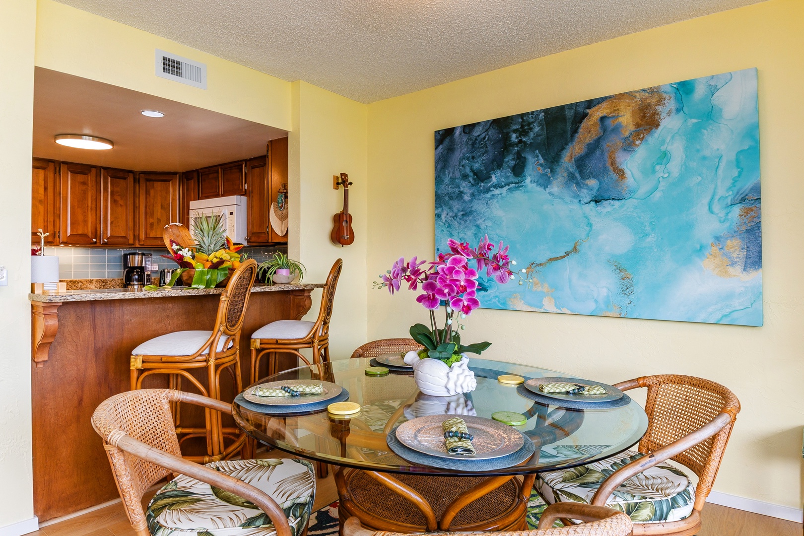 Bright, cheerful dining space where you'll gather for morning coffee and island-fresh meals, with tropical touches and breezy, welcoming vibes throughout.