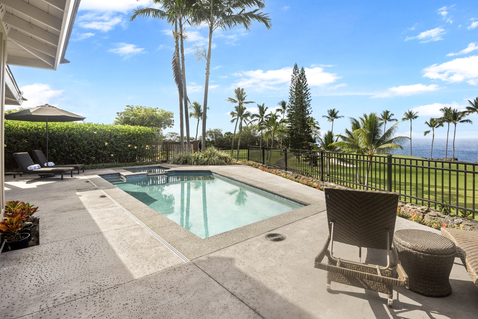 Your private pool terrace offers stunning ocean views framed by swaying palms, creating the perfect tropical sanctuary for relaxation.