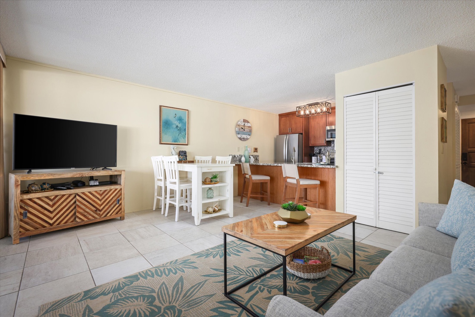 Settle into your bright, open-concept haven where coastal charm meets modern comfort. Unwind on the plush sofa, gather around the dining island, and enjoy home-cooked meals in your fully equipped kitchen—your perfect beach escape awaits.