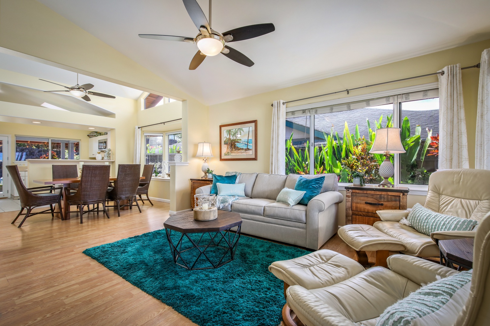 Sink into soft seating surrounded by tropical views and island breezes. This bright, open living space invites you to unwind with coastal colors, natural light, and plenty of room to gather with loved ones.
