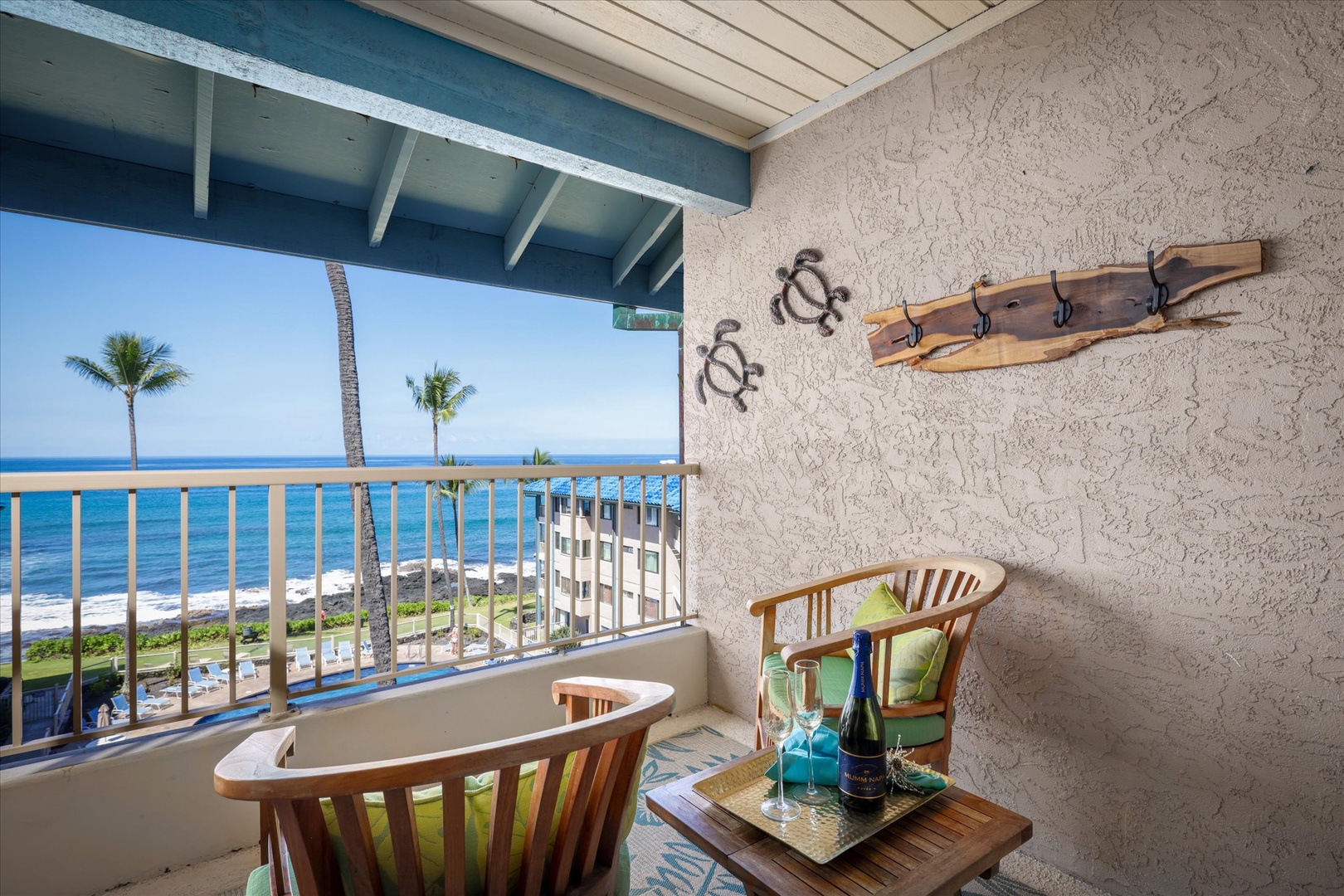 Your private lanai overlooks stunning ocean views, with swaying palm trees and coastal beauty framing your morning coffee or evening champagne—perfect for unwinding in paradise.