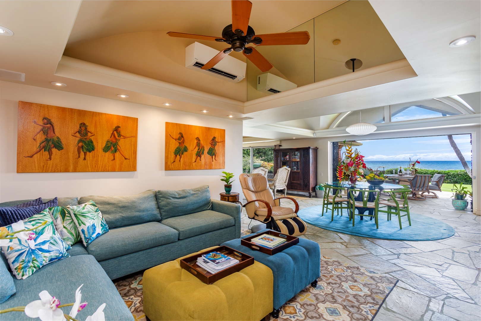 Unwind in your bright, open living space where island-inspired art, plush seating, and sparkling ocean views create the perfect backdrop for your tropical escape.
