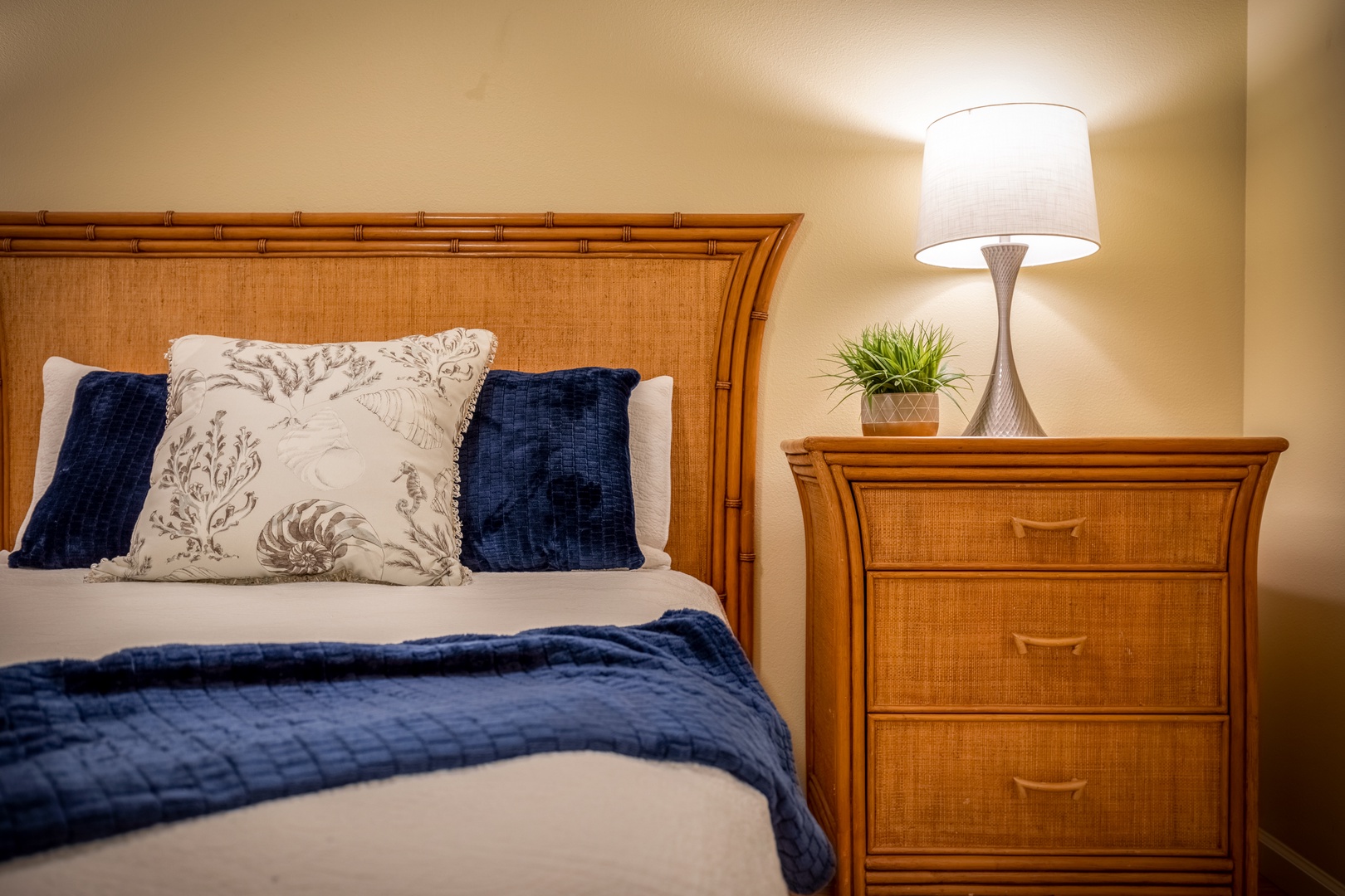 Drift off in your cozy retreat with warm bamboo touches, soft linens, and gentle lamplight setting the perfect mood for rest.