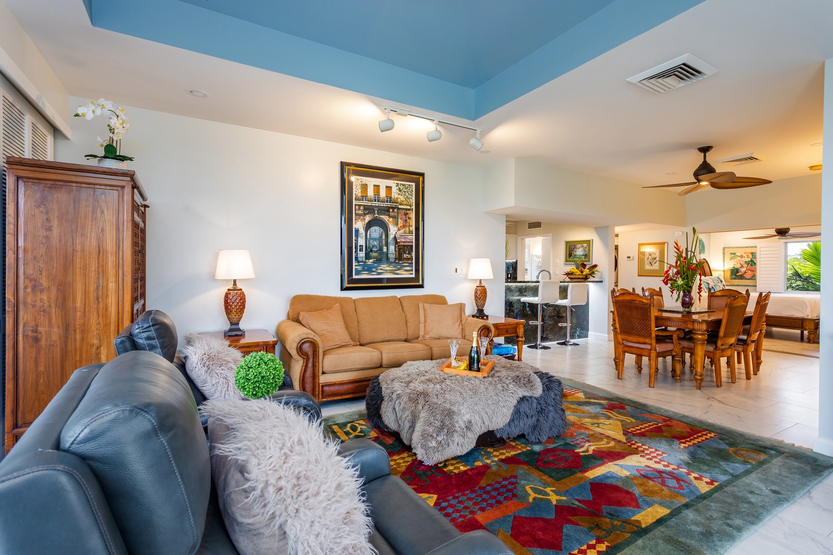 Step into your bright, welcoming living space where comfortable seating and thoughtful touches create a warm, relaxing retreat. The open layout connects you seamlessly to the dining area, inviting you to unwind in style.