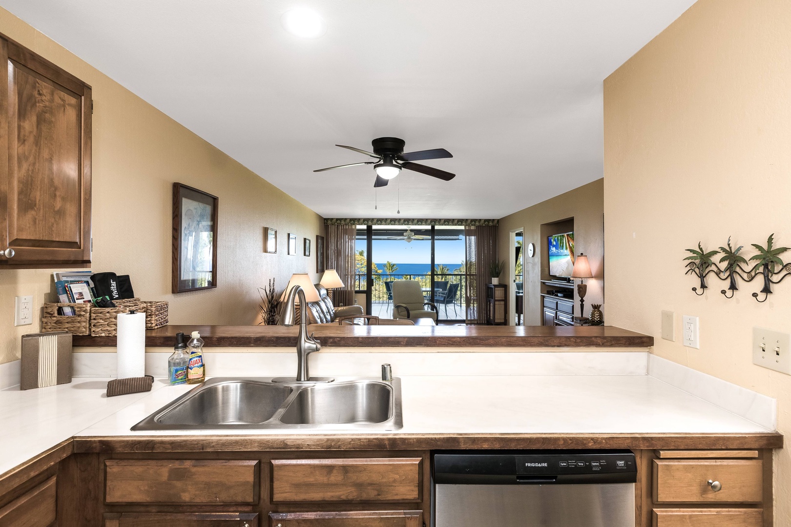 Bright open-concept space with a fully equipped kitchen flows into your living room, opening onto a private balcony with stunning ocean views.