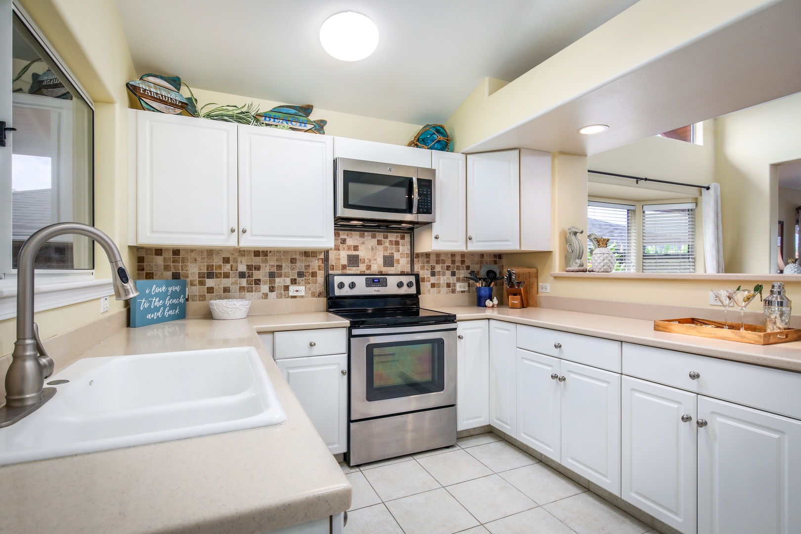 Your bright, fully-equipped kitchen welcomes you with warm tile accents, modern appliances, and everything you need to whip up meals during your stay.