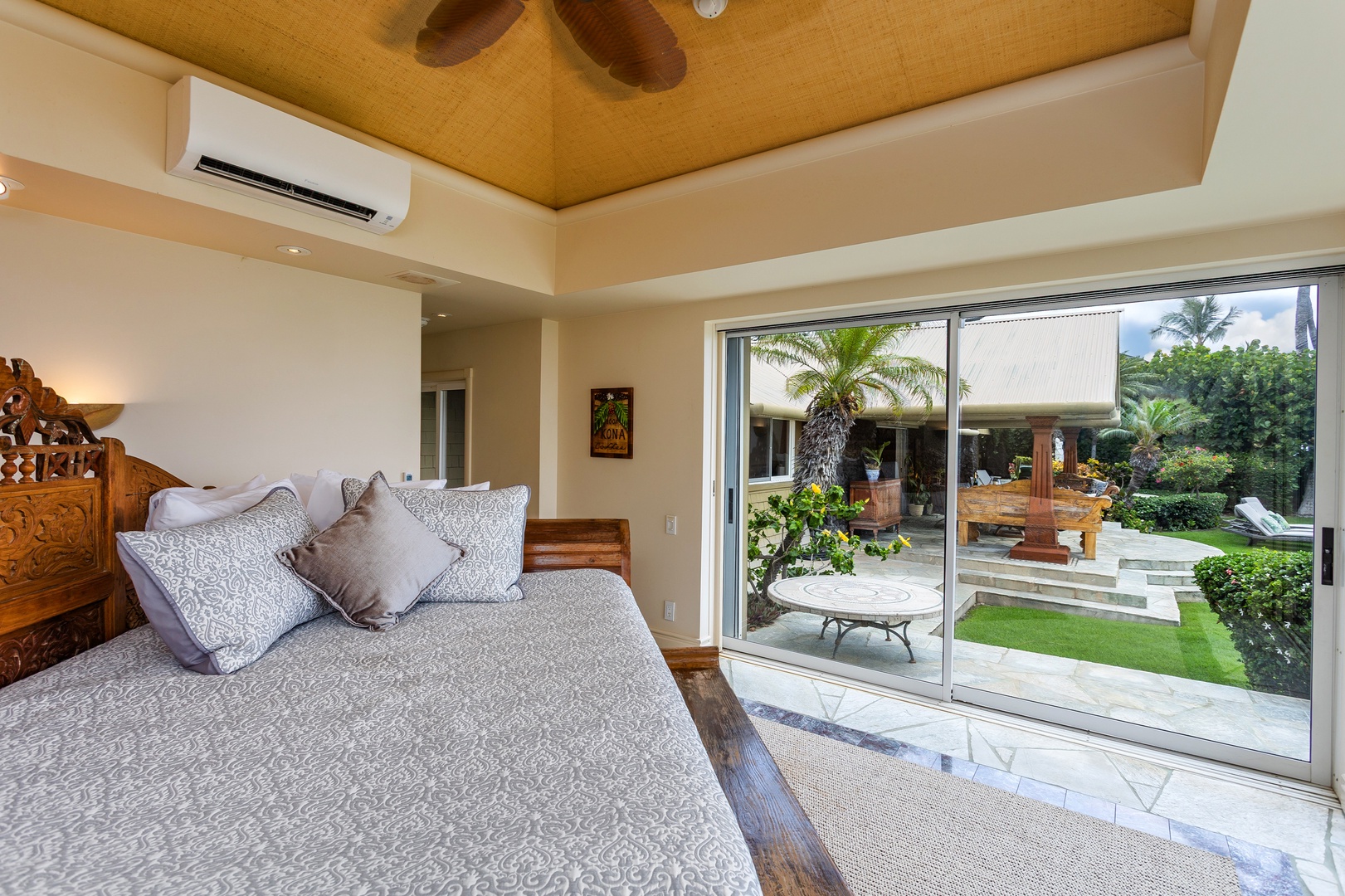 Ohana (Guest House) - Wake to sunlight streaming through sliding glass doors that open to your private tropical garden oasis. The warm wooden ceiling and handcrafted bed create a serene island sanctuary for your perfect getaway.