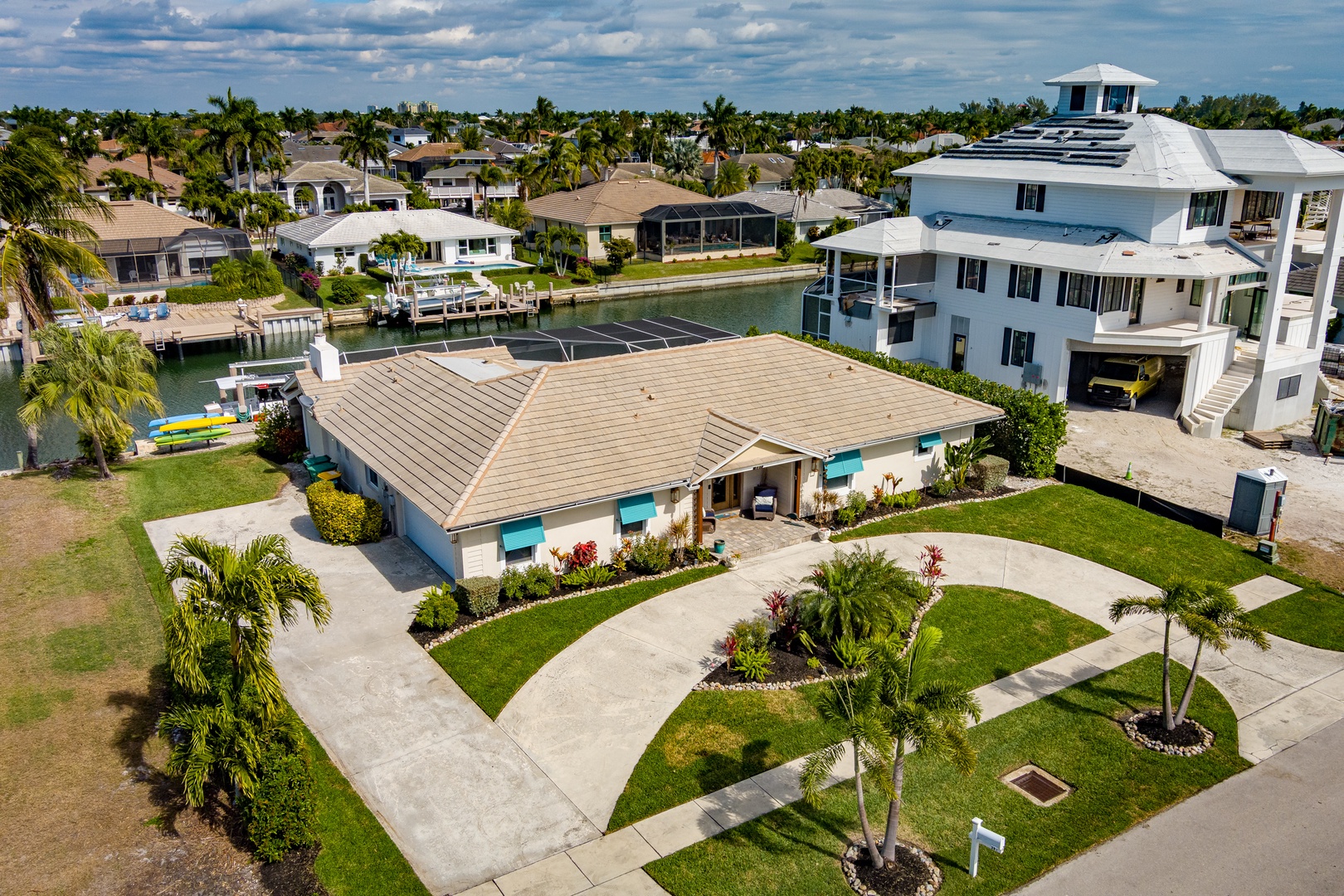 Stunning waterfront property featuring manicured landscaping and convenient boat access in this desirable Florida neighborhood.