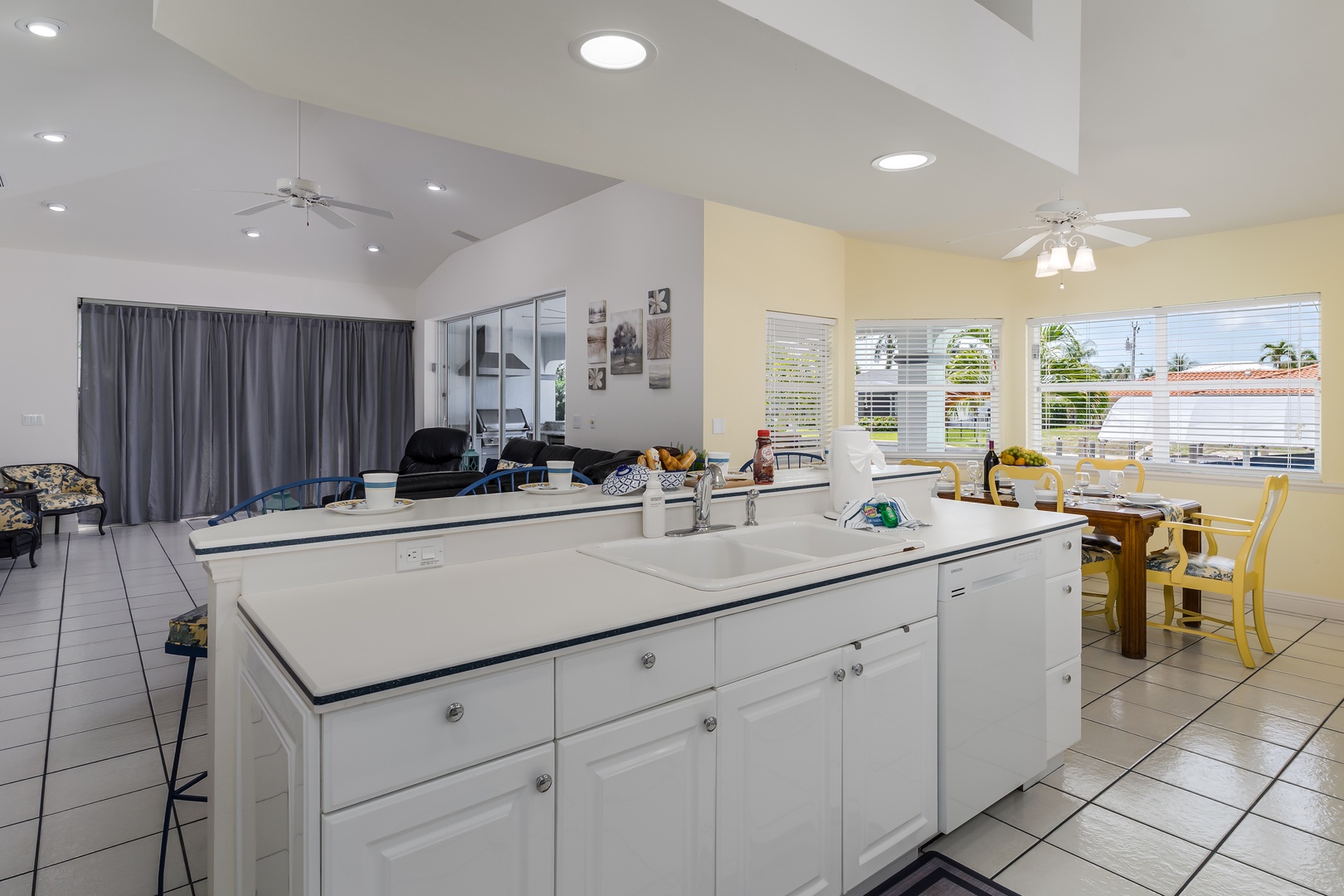 Bright open-concept living where your vacation unfolds seamlessly—cook, dine, and relax all in one sun-filled space designed for togetherness.
