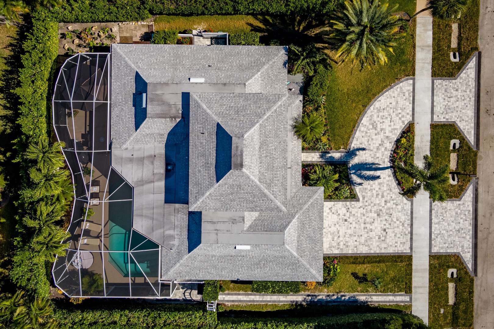 Aerial view showcases the property's distinctive architecture and prime location in a well-maintained residential neighborhood.
