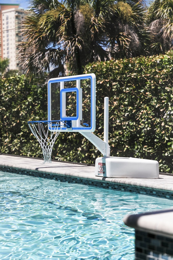 Your poolside basketball hoop awaits—take a shot, cool off with a splash, and enjoy sunny days your way in this tropical retreat.