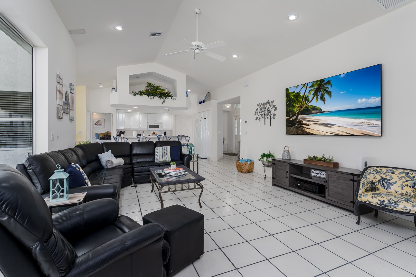 Relax in your spacious living room with plush seating and a large-screen TV, perfect for unwinding after a day of adventure. The open-concept design invites you to connect and create memories.