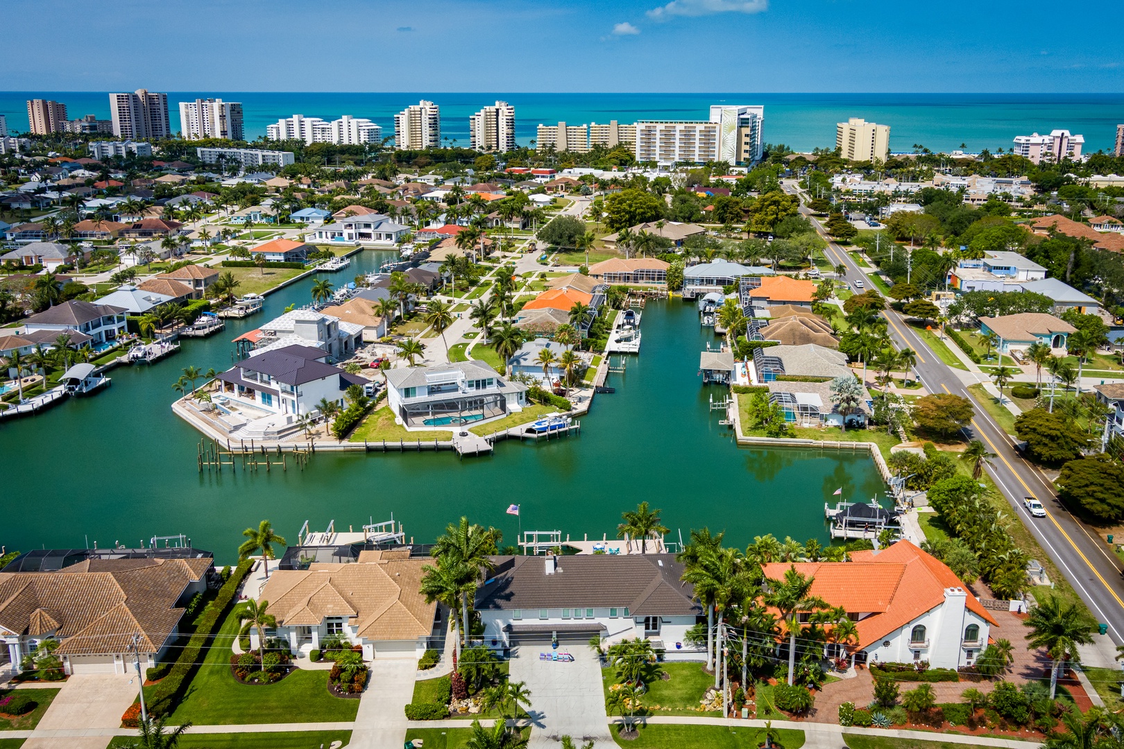 Stunning coastal neighborhood featuring waterfront homes with private docks, turquoise canals, and direct ocean access—an idyllic tropical setting for water lovers.