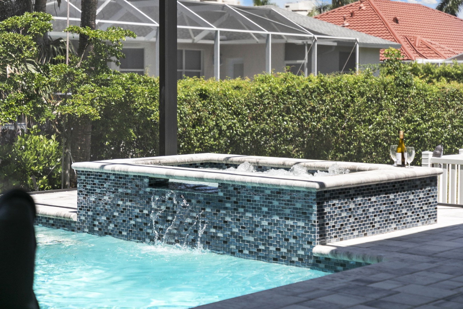 Slip into the sparkling hot tub and let the bubbling jets melt your stress away. Surrounded by lush greenery and sunshine, this is your perfect spot to sip a cool drink and soak in pure relaxation.