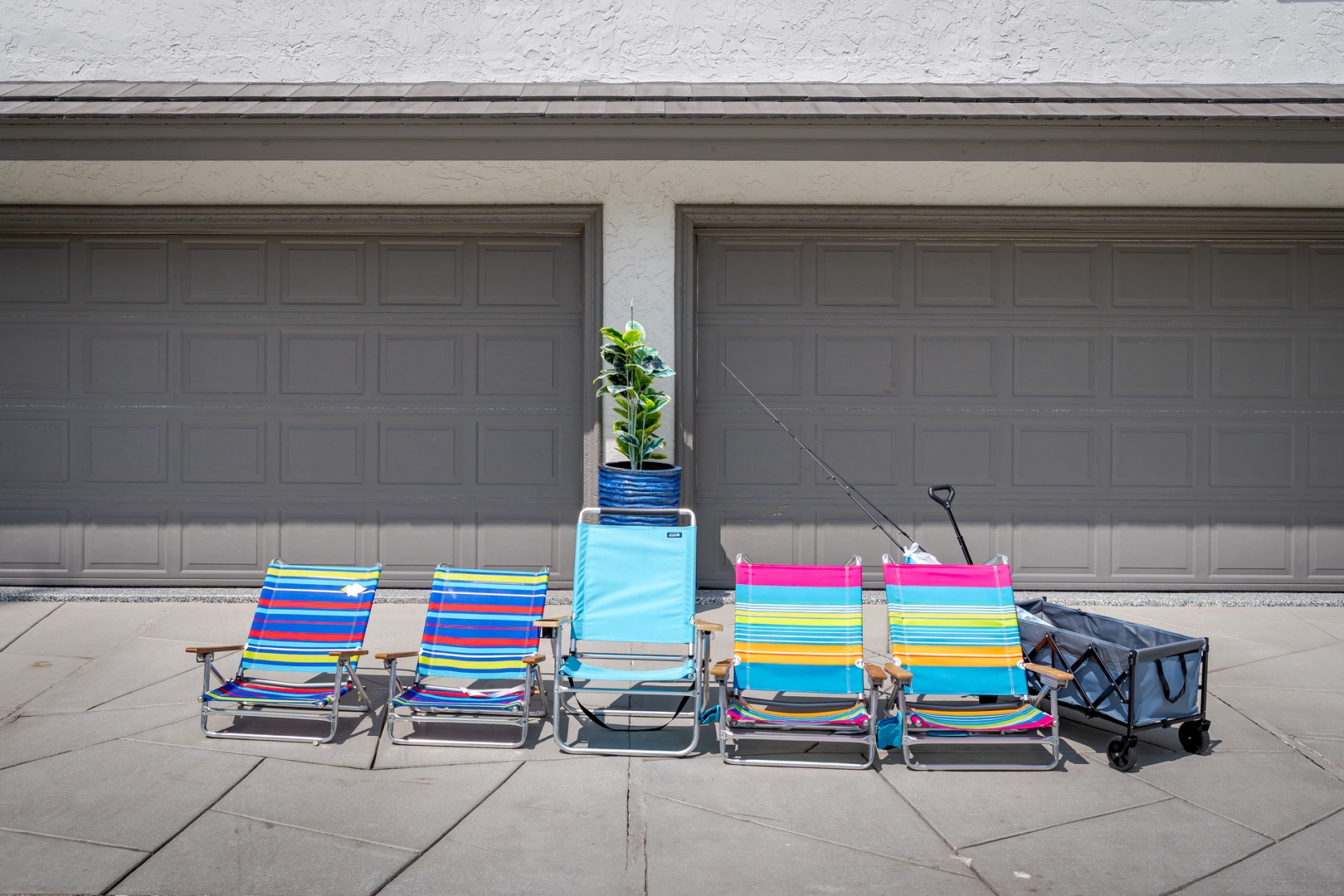 Convenient beach gear awaits your arrival—just grab your colorful chairs, cooler, and cart for effortless days by the water.