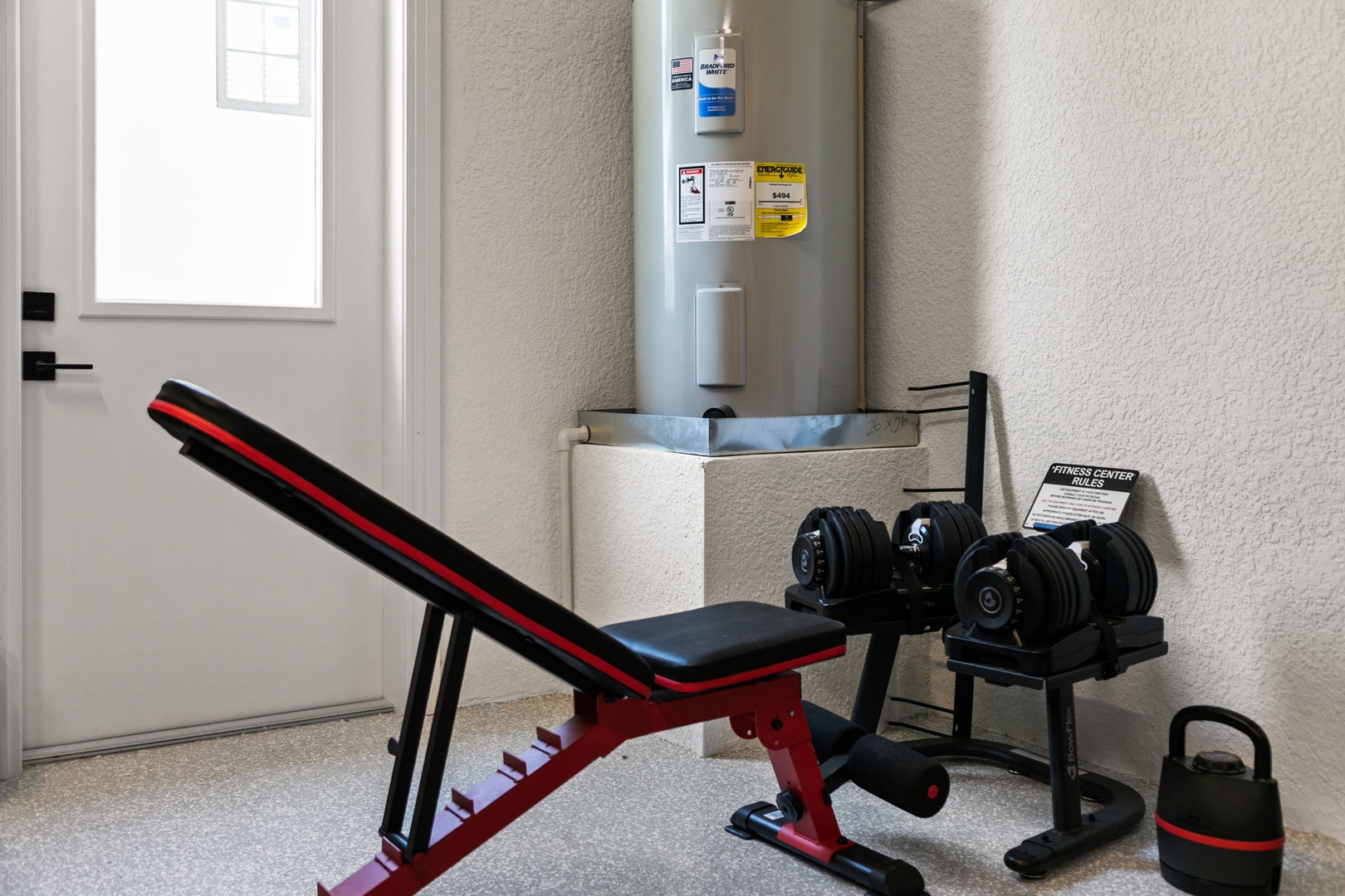 Your private workout space awaits, complete with an adjustable bench, free weights, and kettlebell—perfect for maintaining your fitness routine while you relax and recharge.