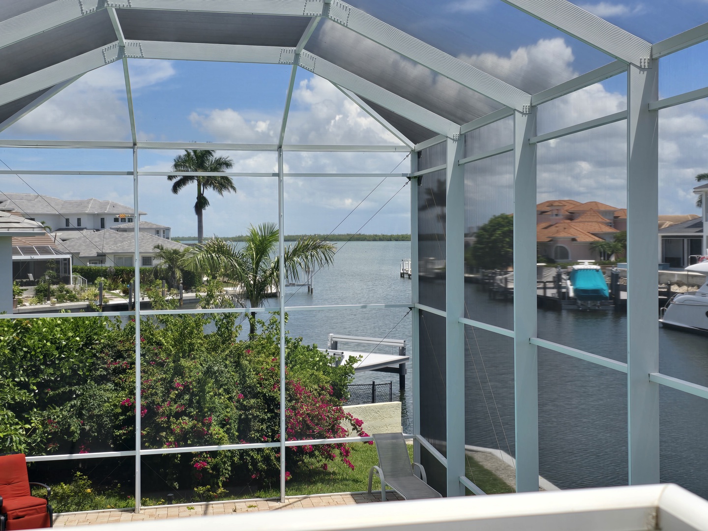 Relax under your private screened lanai while enjoying stunning waterfront views and tropical surroundings.