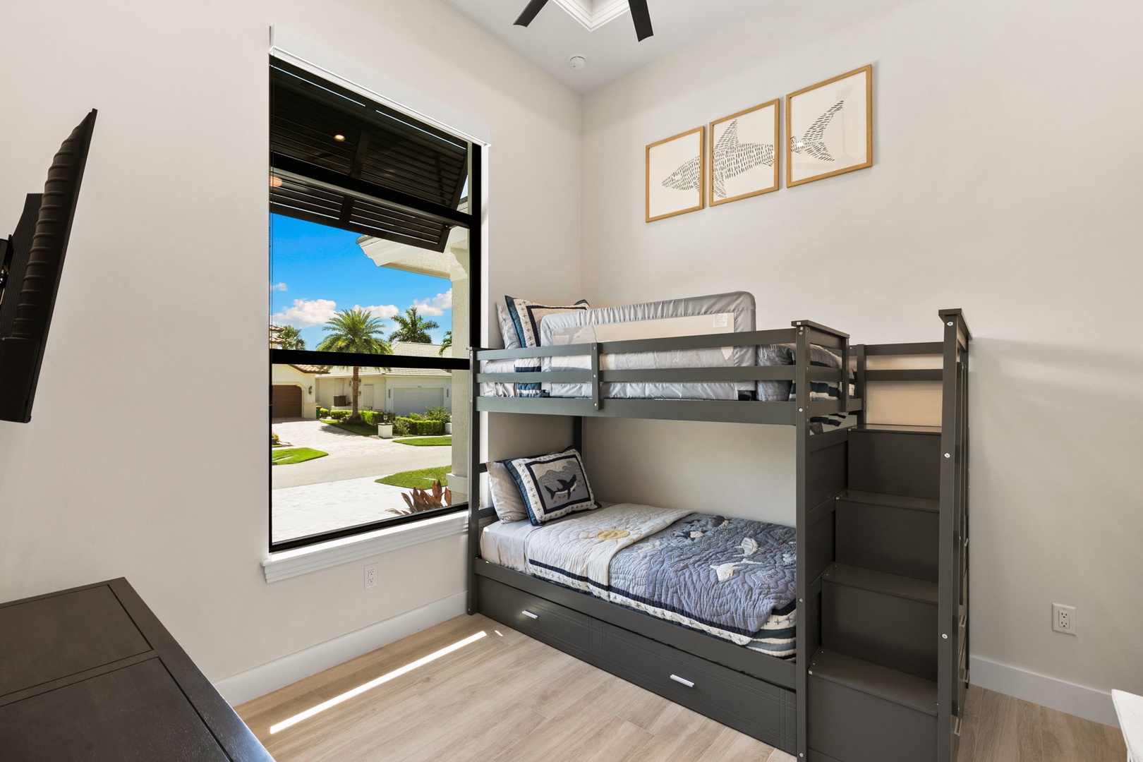 Your kids will love this thoughtfully equipped bedroom.  Every night is a sleep-over with the stairwell bunk bed and a hidden lower-bunk trundle and a large window that fills the room with natural light creating a calming space for rest and play.
