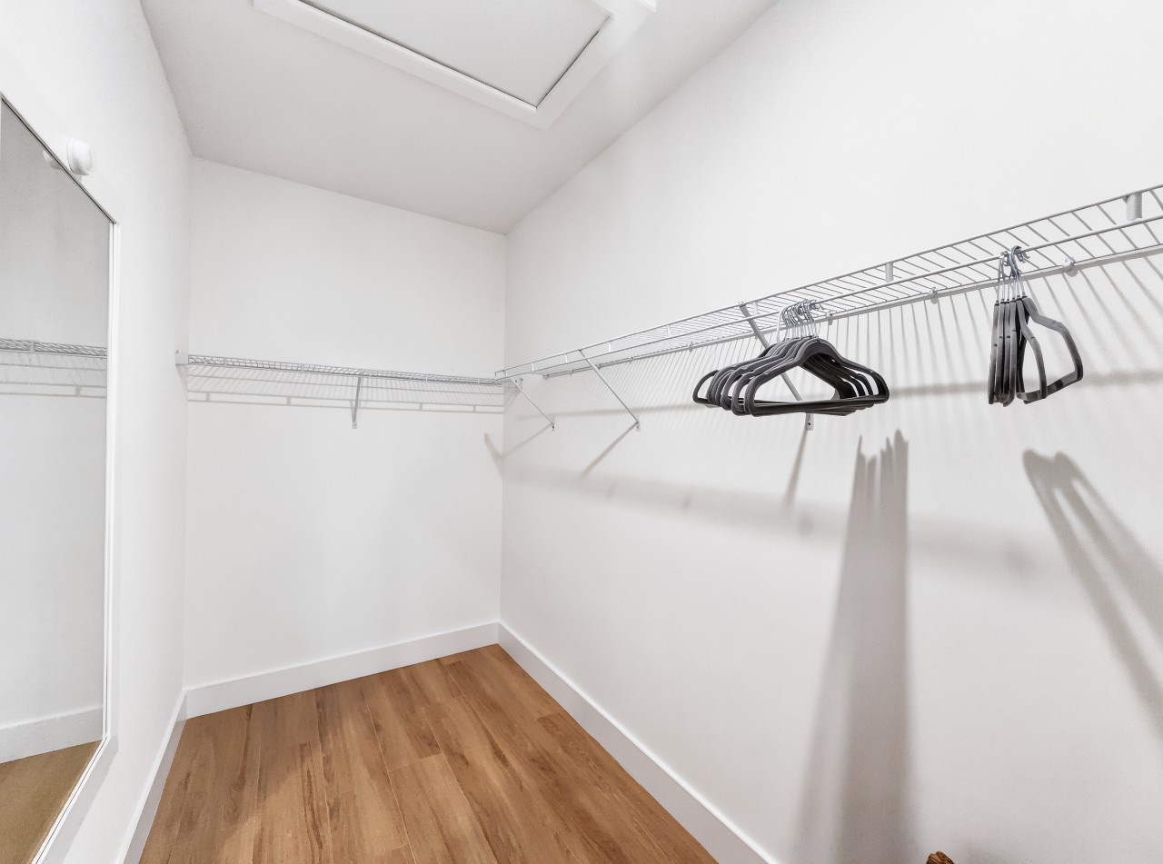 Generous walk-in closet with ample hanging space and natural light, giving you plenty of room to organize your wardrobe and settle in comfortably.