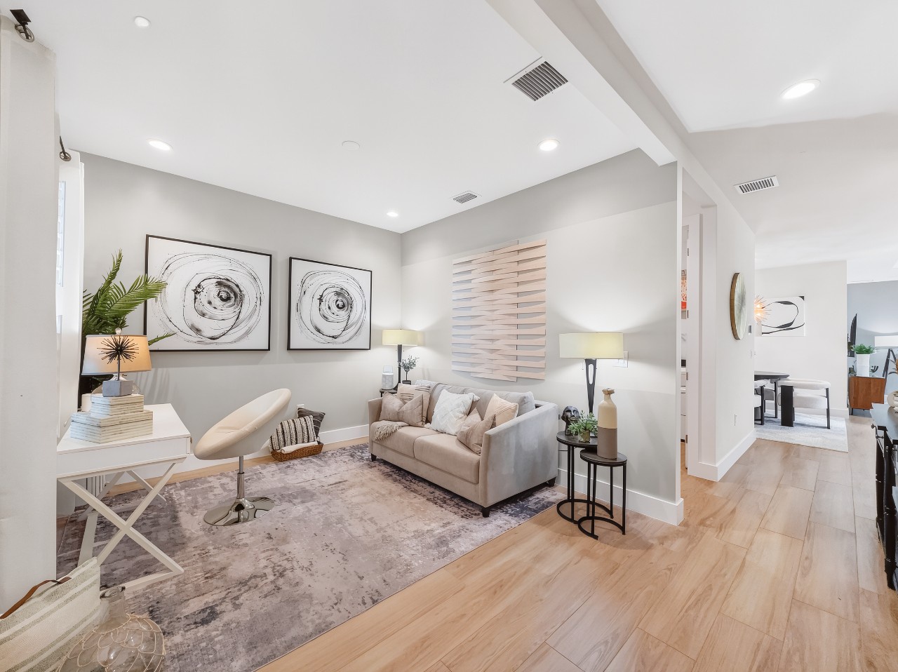 Unwind in your light-filled living space, where vaulted ceilings and modern décor create an inviting retreat perfect for relaxing after a day of exploring.