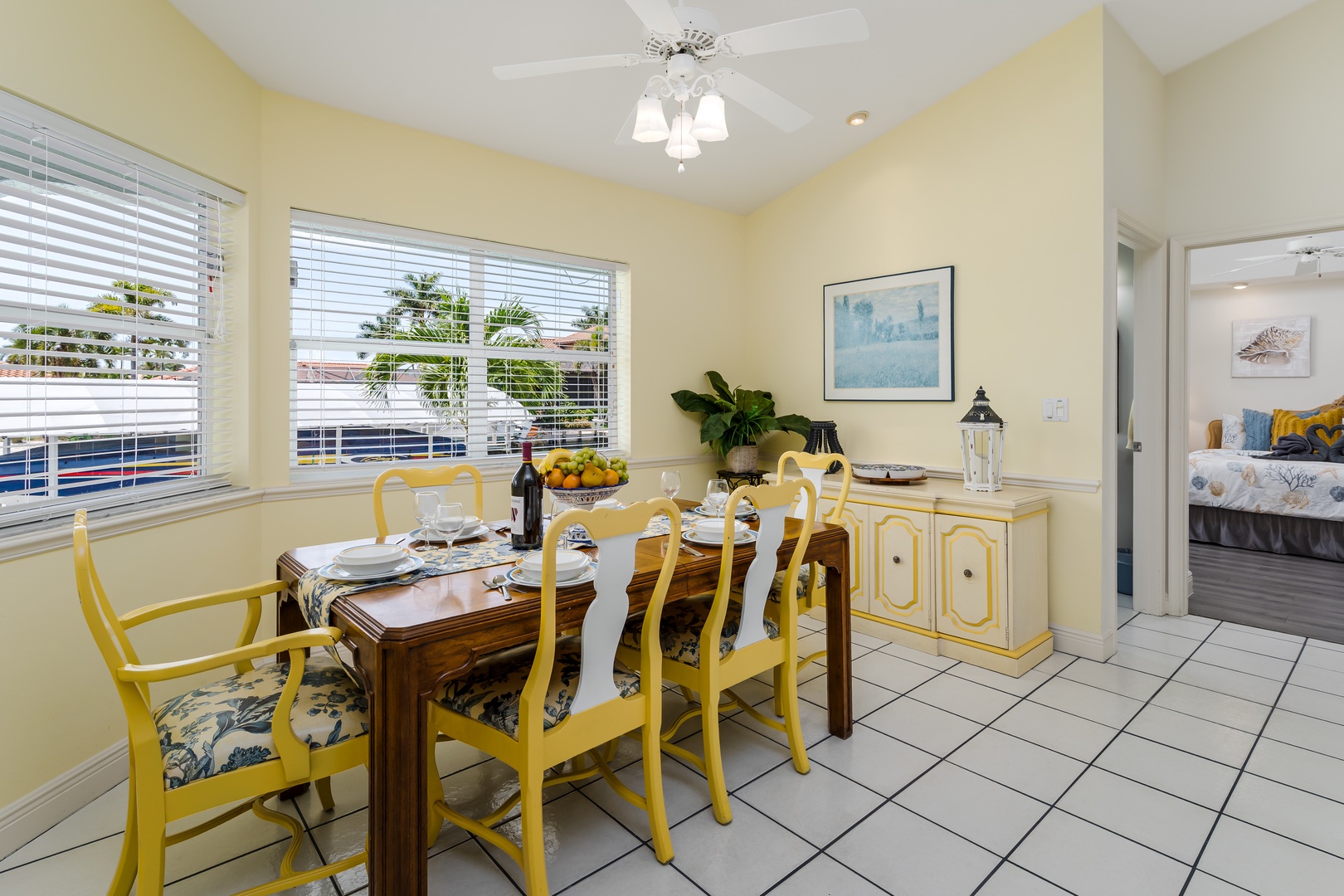 Gather around the dining table for home-cooked meals in this sunny, cheerful space. The bright yellow chairs, natural light, and vintage touches create a welcoming atmosphere where you'll love sharing stories over wine and laughter.