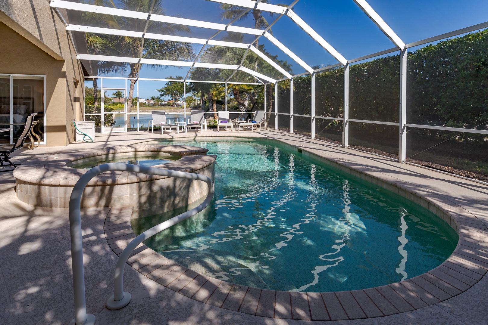 Your private pool sanctuary awaits, complete with bubbling hot tub and screened lanai for endless sunny days and starlit evenings.