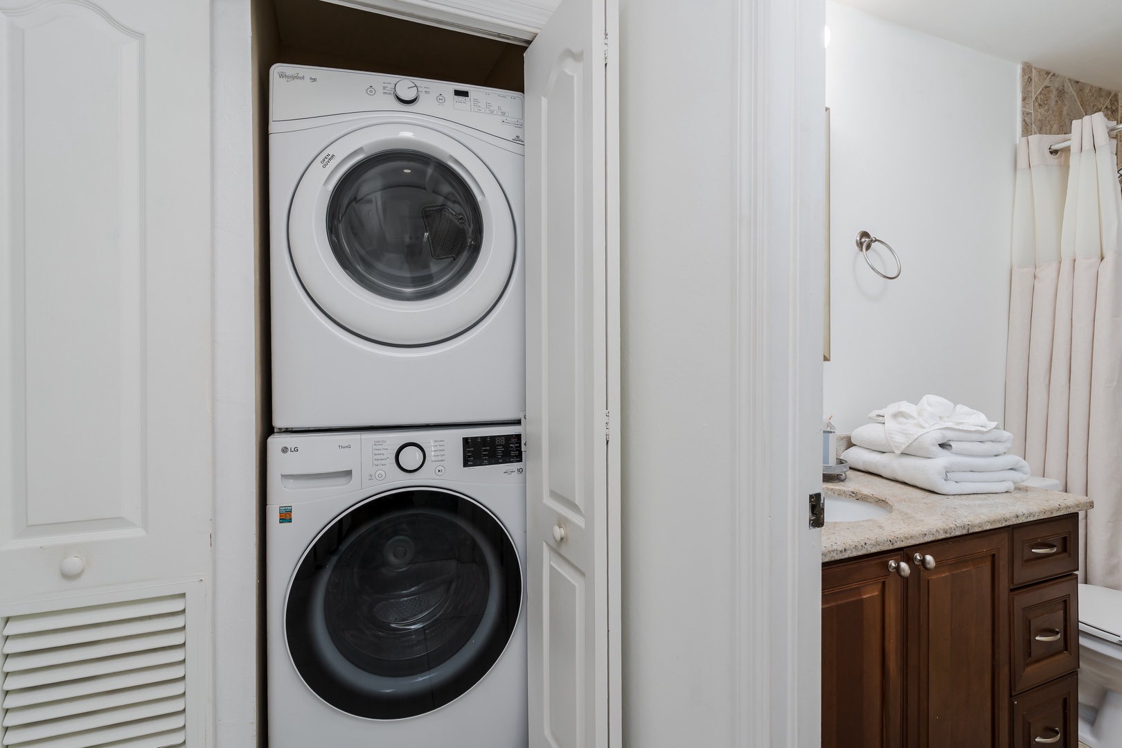 Enjoy the convenience of in-unit laundry with a stacked washer and dryer tucked neatly into your space—fresh towels and linens whenever you need them.