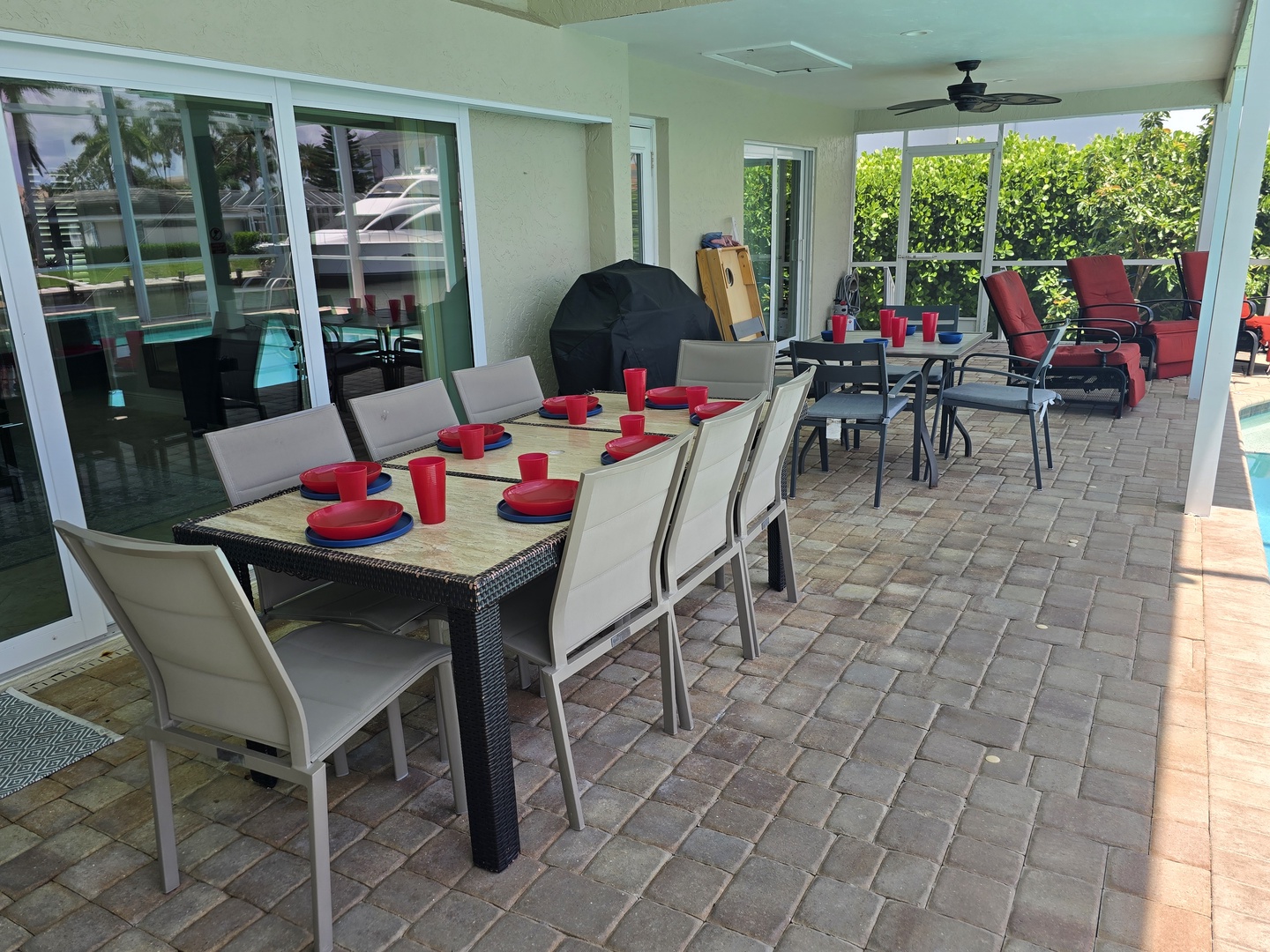 Your covered patio offers the perfect spot for outdoor dining with seating for eight and a grill ready for poolside barbecues.