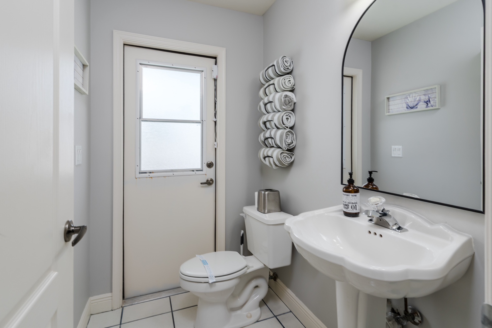 Crisp, bright bathroom with plush towels and quality amenities for your comfort. Fresh design and thoughtful touches make your daily routine feel like a spa escape.