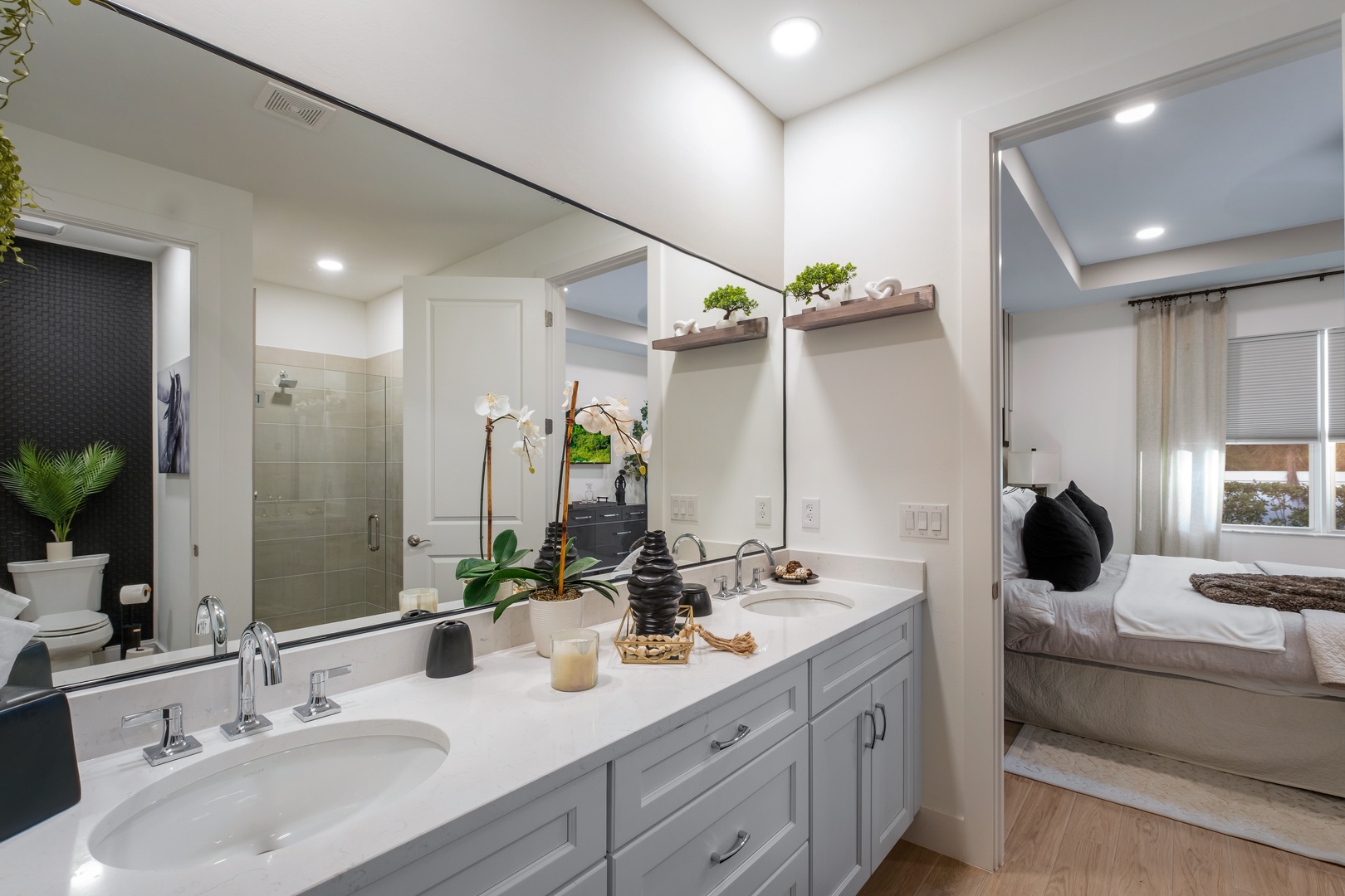 Your spa-like bathroom features dual vanities and elegant finishes, with your cozy bedroom just steps away for ultimate relaxation.